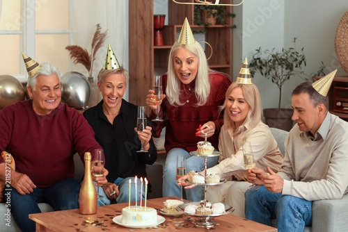 Mature people with champagn...