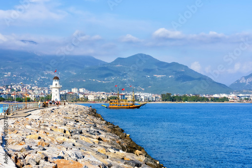 Quadro su tela Scenic view of Alanya, Turkey featuring a lighthouse on a rocky pier, a traditio