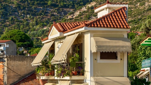 Quadro su tela Vathy, Greece - July 25, 2026: View of a house in Vathy on Samos Island, Greece, showing local residential architecture, simple facade, windows, and peaceful Greek island town atmosphere