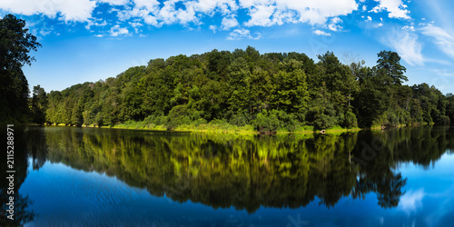 Middlebury Hiking Series: Otter Creek panorama with forest and water reflection along TAM, Trail Around Middlebury, in Vermont, USA