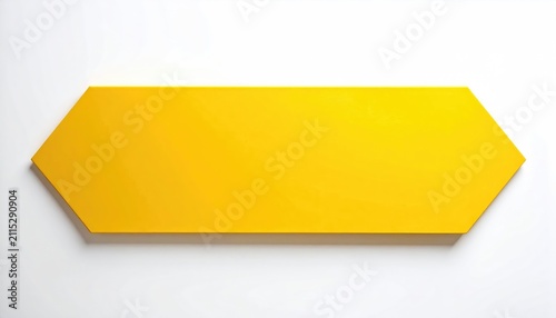 A bright yellow, elongated hexagonal plaque hangs on a white wall