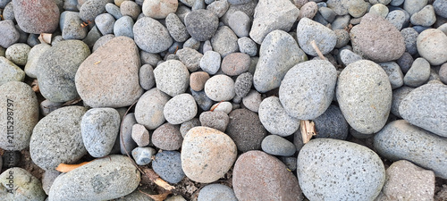 Photography Smooth grey river stones and pebbles background in natural light