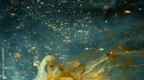 4K Teal Liquid with Golden Glitter Particles. Abstract Fluid Motion Background, Macro Texture Video, 2160p