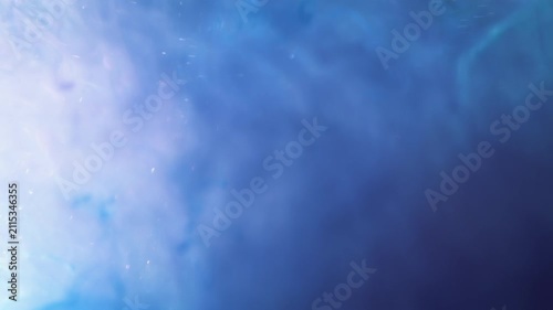 4K Blue Liquid Abstract Background. Flowing Ink, Glitter Particles and Fluid Motion, Macro Texture Video, 2160p