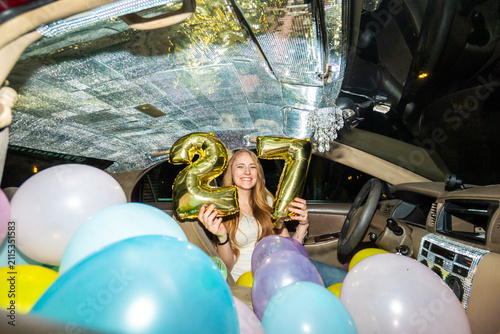 Birthday celebration inside car with balloons and festive decor