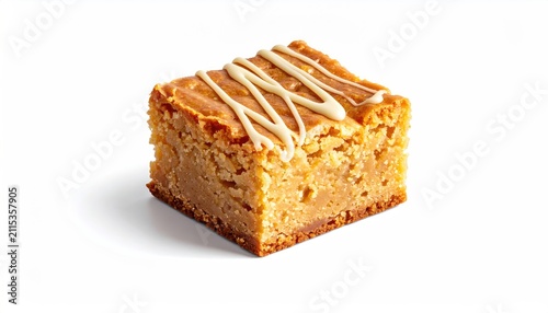 Golden baked square with white drizzle on white background