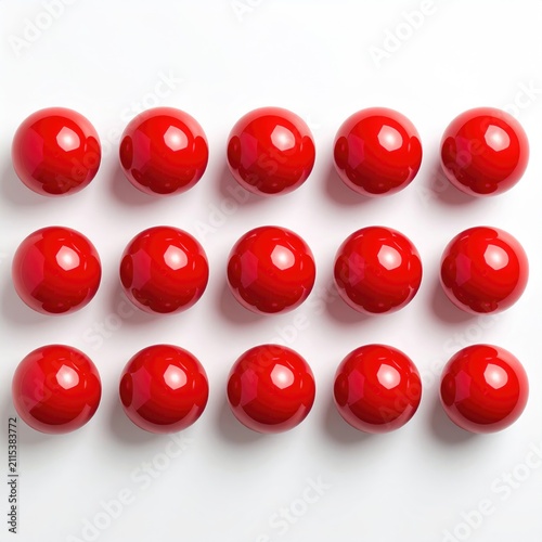 Fifteen glossy red spheres arranged in three horizontal rows on a white surface