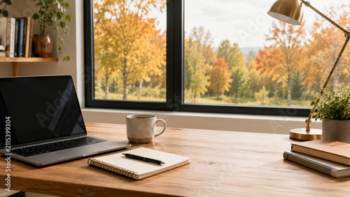 Modern office desk with autumn window view
