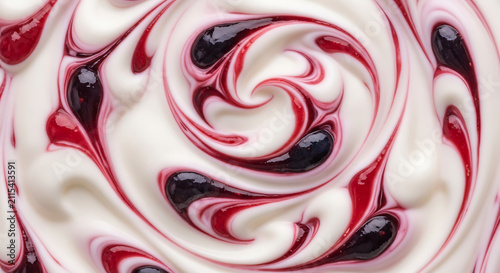 Swirls of creamy yogurt with berry ripple, close-up macro shot, abstract food texture.