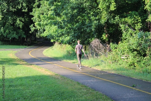 Young man walking on the North Branch Trail at Miami Woods in Morton Grove, Illinois