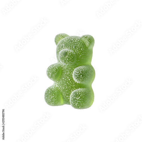 Single green sour gummy bear candy coated in sugar crystals isolated on a transparent background