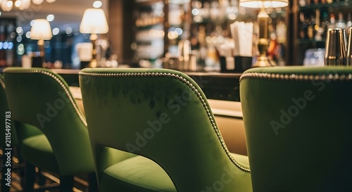 Green chairs at a restaurant bar.
