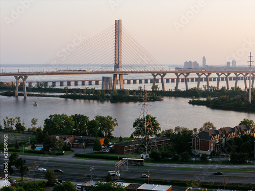 Bild auf Leinwand Cable stayed bridge over St Lawrence River at golden sunrise near Montreal and Brossard, Canada