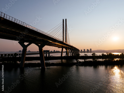 Bild auf Leinwand Cable stayed bridge over St Lawrence River at golden sunrise near Montreal and Brossard, Canada