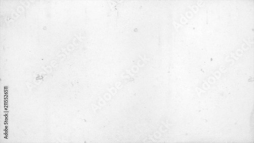 Vintage old film texture loop with heavy scratches, dust particles, and organic grain overlay on a light grayscale background