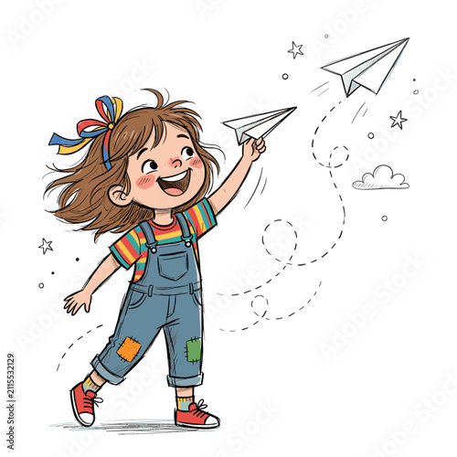 Little girl with brown hair wearing denim overalls playing with flying paper airplane toy