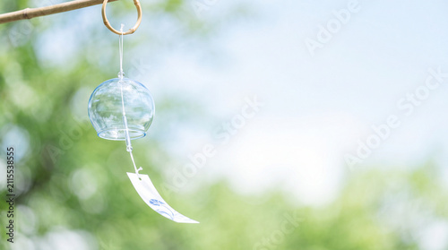 Transparent Japanese Wind Chime with Fresh Green Bokeh and Copy Space