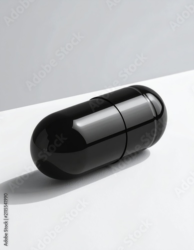 Sleek, shiny black capsule-shaped object on a minimalist white surface