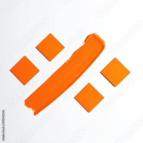 Orange brushstroke forms percentage symbol with squares on white