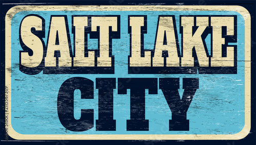 Aged and worn vintage Salt Lake City sign on wood