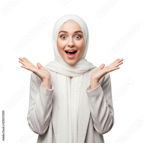 Surprised young muslim woman wearing hijab looking at camera isolated on transparent background