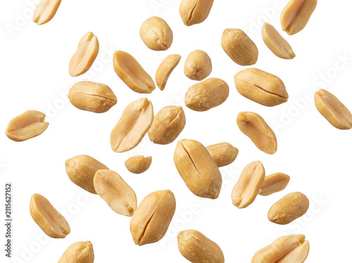 Falling roasted peanuts isolated on white. Organic snack nuts flying in the air.