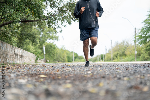 Senior old man runner exercise outdoor nature park. fitness man jogging wearing sportswear. Mature athlete man in sportswear Workout running at public park. Health and activity old man lifestyle