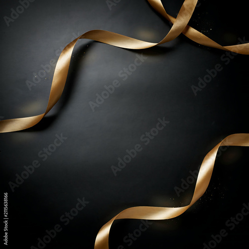 Elegant gold silk ribbon flowing on a dark background for celebration transparent background
