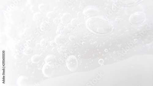Cosmetics serum gel background, cream, shampoo, macro soap bubbles, foam texture