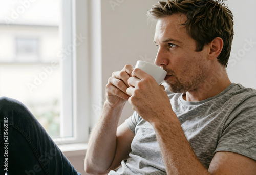 Thoughtful man drinking cof...