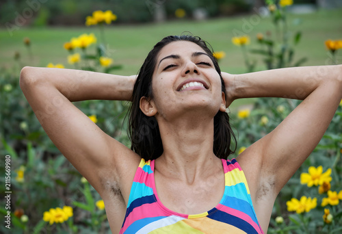 Happy young woman with natu...