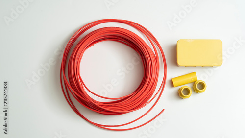 Foto Top view electrical junction box and red roll electrical wire isolated on white background