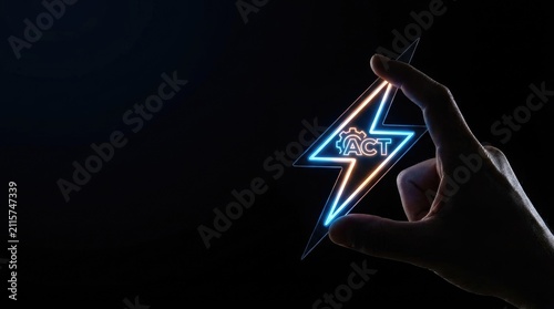 Human hand holding glowing lightning bolt symbol with gear icon representing actionable digital strategy concept