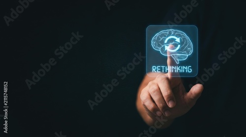 Person touching digital brain icon representing rethinking concept for personal development