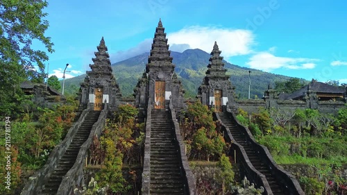 Drone push-in above Pura Penataran Agung Nangka Balinese Hindu temple revealing Mt. Agung, Bali, Indonesia