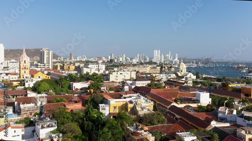 Aerial View of Cartagena de Indias Walled City, Colombia: Historic Rooftops and Modern Skyline with Harbor and Caribbean Sea under Clear Blue Sky