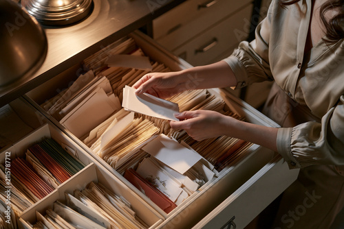 Curator auditing a color-coded seed accession drawer