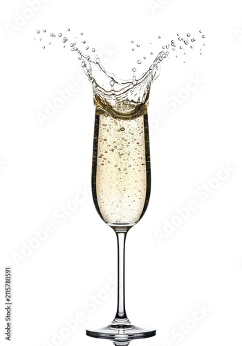 A crystal champagne flute with an erupting golden liquid crown and frozen droplets on a transparent studio background dynamic beverage advertising