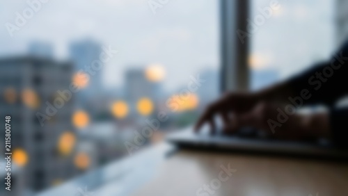 Blurred Professional Typing on Laptop for Modern Fintech App Banner