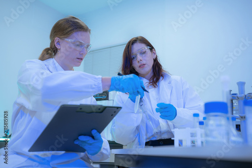 Fotografie scientist or doctor team with tech for scientific innovation, planning or data report