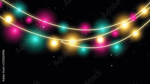 Festive string lights on a black background create a magical and celebratory atmosphere with vibrant colors.