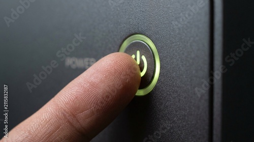 Green Power Button Pressed by Finger
