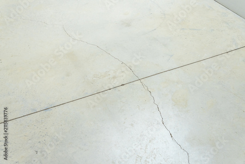 Cracked concrete floor with a diagonal line