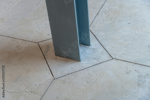 Architectural Detail: Gray Column and Geometric Floor
