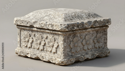 Weathered stone ossuary box with flower relief carving