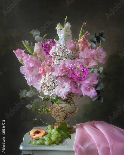 Still life with summer flowers and fruits