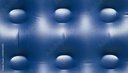 Фотография Close up of a blue inflatable mattress surface with a patterned button structure