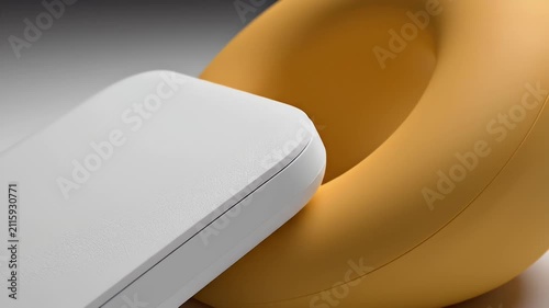 Sleek White Wireless Charging Pad Resting on a Soft Gray Surface with Bright Yellow Curved Background