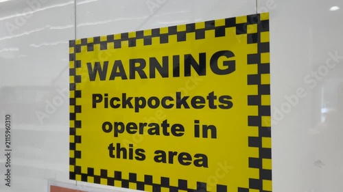 Warning of pickpockets signage