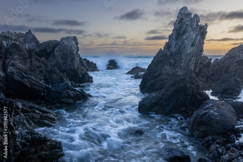 Incoming tide crashing into rocks